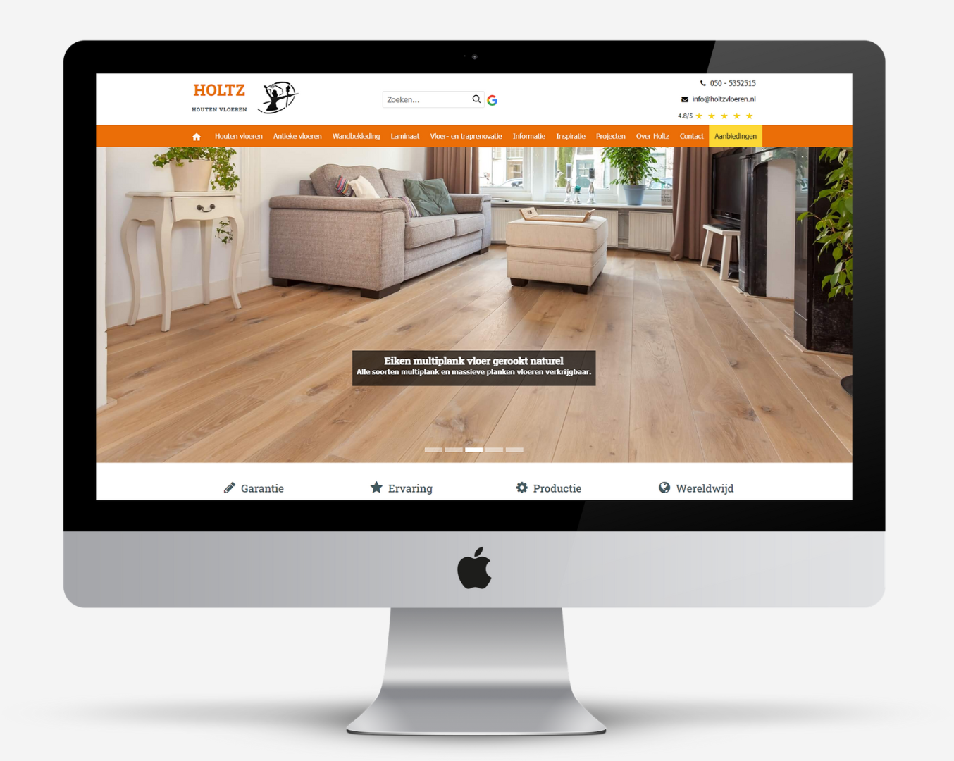 Monitor met de website 'holzvloeren.nl' open